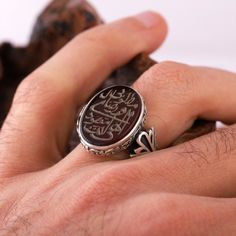 "This stunning Engraved Agate Islamic Zikir Ring features the beautiful calligraphy of two powerful zikir phrases: \"Ilahi Ente Maksudi\" and \"Rizake Matlubi\". The ring is made of red aqeeq stone, a precious gemstone that holds special significance in Islamic culture. This Sufi ring is perfect for Muslims looking to deepen their faith and spirituality, and it makes a thoughtful Eid jewelry gift for your loved ones. Handcrafted with care, this ring is a unique and meaningful piece that you'll c Islamic Culture, Beautiful Calligraphy, Precious Gemstones, Signet Ring, Handmade Bracelets, Handmade Necklaces, Jewelry Gift, Fathers Day Gifts, Father's Day