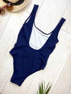 "FREE SHIPPING TO USA FOR ALL ORDERS OVER 35$! Choose right size by following our size chart below, thank you! We use FEDEX PRIORITY shipping service to the United States to guarantee the fastest delivery in 3-4 days. One piece swimsuit in dark blue fabric. Round neckline, shoulder straps, open back, high cut and lining at crotch. Stretchy and body fitting material. COLOR: DARK BLUE MEASUREMENTS: X-Small - Bust - 31\" - 32\" / 80 - 80 cm - Hips - 32\" - 34\" / 82 - 86 cm - Waist - 22\" - 23,5\"/ Navy One-piece Bodysuit For Swimming, Navy Beachwear Bodysuit For Pool, Navy One-piece Bodysuit For Pool, Navy One-piece Swimwear With Lined Body, Navy One-piece Swimwear, Navy Stretch Bodysuit For Beach, Navy Sleeveless Lined Swimwear, Navy Stretch Bodysuit For The Beach, Navy One-piece Beachwear Bodysuit