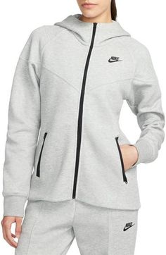 Stay cozy and warm without the extra bulk in a full-zip hoodie made from lightweight tech fleece and finished with convenient zippered pockets. 25" front length; 27" back length (size medium) Front zip closure Fixed hood Front zip pockets 53% cotton, 47% polyester Machine wash, tumble dry Imported Nike Windrunner, Nike Sportswear Tech Fleece, Nike Sportswear Women, Nike Tech Fleece, Nike Tech, Asics Women, Tech Fleece, Nike Store, Nike Hoodie