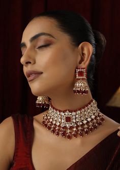 Make a striking statement with this Red Polki Choker set, featuring radiant red stones set in traditional Polki design and finished with a luxurious rose gold touch. The elegant choker design offers a contemporary twist on classic beauty, with the rose gold accents enhancing the deep red hues. Ideal for weddings, festive occasions, or any special event, this set brings together timeless sophistication and modern flair. Elegant Red Sets For Festivals, Red Hand Set Kundan Necklace For Party, Formal Red Kundan Necklace For Festivals, Red Jewelry Sets For Formal Festivals, Luxury Red Jewelry For Festive Occasion, Luxury Red Festive Jewelry, Hand Set Red Kundan Ruby Necklace, Elegant Red Kundan Necklace For Wedding, Festive Red Ruby Jewelry Set