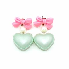 "These adorable earrings are perfect for Valentine's Day or anytime of the year! Pastel pearl finish heart shaped macaron charms filled with whipped cream hung below pink bow posts with glass pearls. Posts are hypoallergenic surgical steel. Choose pink, purple or mint green. Charms are about 1\" wide. Total earring length: about 2\". Matching necklaces and rings in my shop>> https://etsy.com/shop/fatallyfeminine **Made to order - please allow 2 weeks for your item to be made before shipmen Cute Heart Earrings For Valentine's Day Wedding, Cute Heart Earrings For Wedding On Valentine's Day, Cute Wedding Earrings For Valentine's Day, Cute Party Earrings With Heart Charm, Cute Heart Charm Earrings For Party, Cute Heart Drop Earrings For Party, Cute Heart Earrings For Party, Heart-shaped Sweet Earrings For Party, Cute Heart Beads Drop Earrings