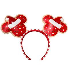 a red minnie mouse ears headband with donuts on it's ears,