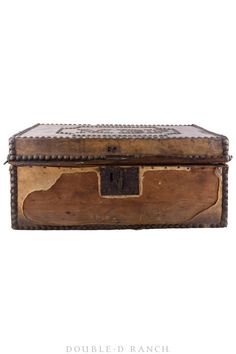 an old wooden box with metal trimmings on the top and bottom, sitting in front of a white background