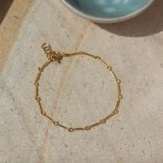 One of our favorite chains; now offered as a bracelet! MEASUREMENTS Bracelet Sizing: XS=5.5", S=6", M=6.5", L=7", XL=7.5"Offered in 14k Gold Fill or sterling silverHypoallergenic and water-proof To measure your wrist size, wrap a piece of string around your wrist the way you would like the bracelet to fit. Then lay the string flat and measure the inches to get your size. Bracelet Stands, Bracelet Measurements, Sterling Silver Anklet, Silver Anklets, Ankle Bones, Ring Size Guide, Water Proof, 8 M, Custom Rings