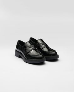 Black Patent leather loafers | PRADA Sleek Black Slip-ons With Rubber Sole, Luxury Black Slip-ons With Round Toe, Black Calf Leather Loafers With Rubber Sole, Sleek Black Calf Leather Loafers, Black Calf Leather Slip-ons, Black Slip-on Calf Leather Loafers, Luxury Black Leather Slip-ons, Sleek Patent Leather Loafers With Rubber Sole, Luxury Black Slip-on Loafers