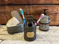 two toothbrushes are sitting in an old can