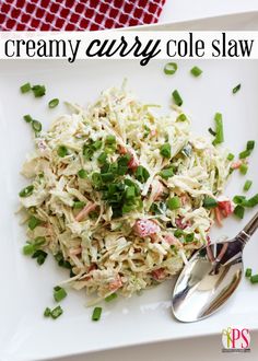 a white plate topped with coleslaw next to a spoon