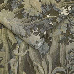 a close up view of a wallpaper with flowers and leaves in grey, green, beige and white colors