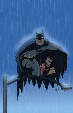 batman and catwoman in the rain on a pole with blue sky behind them,