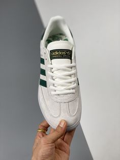 The Adidas Originals Handball sneaker combines retro design with modern comfort, featuring a durable gum sole and a sleek suede upper. Good Grips, Adidas Shoes, Retro Design, Luxury Shoes, Adidas Originals, Tights, Womens Sizes, Adidas, The Originals