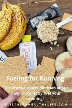 a wooden table topped with crackers, bananas and granola bars on top of it