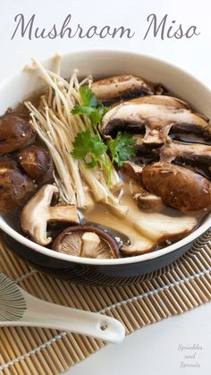 mushroom miso soup in a white bowl with chopsticks and parsley on the side