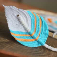 a ball of yarn sitting on top of a wooden table