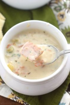 a white bowl filled with soup on top of a table