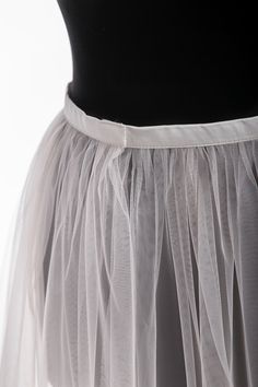 "Tulle overskirt Detachable skirt Tulle Overlay skirt Bridal train Removable tulle skirt Detachable bridal skirt Bridal overskirt This airy tulle overskirt is gorgeous for bride dress Color#1 in our color chart - white color. The skirt is fixed on the waist with a hook-and-loop fastener which is very convenient if you want to remove it. MATERIALS: Tulle: Luxury wedding tulle \"Hayal Tulle\" .Draped, flexible, and very soft and high-quality tulle. Durable and easy to handle. He a thinner and has Lined Tulle Maxi Skirt For Evening, Elegant Flared Tulle Skirt, Evening Tulle Maxi Skirt With Lining, Evening Tulle Flared Skirt, Elegant Flowy Lined Tulle Skirt, Elegant Party Skirt With Detachable Train, Elegant Pleated Full Tulle Skirt, Tulle Lined Skirt, Tulle Lined Flared Skirt