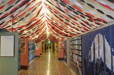 the hallway is decorated with red, white and blue striped fabric covering it's ceiling