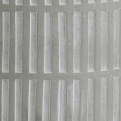 a close up view of the texture of white plastic sheeting with vertical lines on it