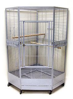 a large bird cage sitting on top of a metal stand