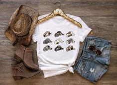 Cowboy hat graphic tee, Cowboy Hat Shirt, Cowgirl shirt, Cowboy Shirt Women, Western Shirt, Faux Cowhide Tee, Country Western T- Shirts ♥ HOW TO ORDER T-SHIRT ♥ 1- Please, Check and Review all Photos. 2- Choose your size from the drop-down menu and add each shirt to your cart one at a time. 3- Select Your Shirt Color from Drop-down 2 which is Shirt Color. 4- Choose Your TEXT Color. Please add your text color on to the personalization box. 5- Your shipping will automatically combine when ordering multiples. 6- Checkout out all at once when the correct color and qty has been added. 7- Finally, Your Custom Shirt will be ready to ship 1-3 Business Day. Holiday times may affect the handling times. -Our shirts are made to order specially for you. Because of this reason we don't accept returns or Summer Cotton Hats With Graphic Print, Cotton Hats With Graphic Print For Summer, Cotton Summer Hat With Graphic Print, Cowboy Hat Graphic, 25th Bday, Baby Clothes Country, Faux Cowhide, Cute Country Outfits, Western Graphic Tees