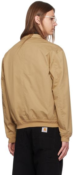 Cotton twill jacket. · Stand collar · Zip closure · Logo embroidered at chest · Flap pockets · Rib knit hem and cuffs · Full cotton twill lining Supplier color: Luxury tan Beige Casual Outerwear With Ribbed Collar, Casual Beige Outerwear With Ribbed Collar, Classic Beige Outerwear With Corduroy Collar, Classic Beige Outerwear With Ribbed Cuffs, Casual Gabardine Outerwear, Brown Cotton Outerwear With Ribbed Collar, Classic Cotton Outerwear With Ribbed Cuffs, Casual Cotton Outerwear With Contrast Collar, Cotton Outerwear With Ribbed Collar For Work