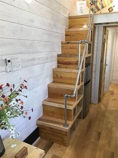 the stairs are made from wood and have metal handrails