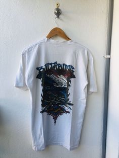 Vintage Original 90’s Billabong RM Illustration Art 1993 Ausie Skate Surf Comapny Clothing T-Shirt by Nonamecolecctions on Etsy 90s Style White Graphic Print T-shirt, White Band Merch Top With Custom Artwork, White Cotton Tops With Custom Artwork, White Graphic Tee With Custom Artwork, Casual White T-shirt With Custom Artwork, Vintage T-shirt With Sublimation Print For Streetwear, Vintage Sublimation Print T-shirt For Streetwear, Vintage White T-shirt With Graphic Design, Vintage Cotton T-shirt With Custom Artwork