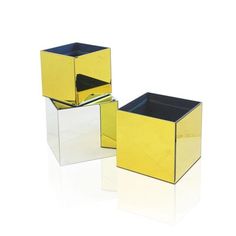 two yellow and black boxes sitting next to each other on top of a white surface