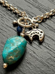 Carolyn Pollack Southwestern sterling  Vintage never worn  Rolo chain Sterling bead Turquoise nugget Lapis lazuli bead Toggle  7 1/2" Southwestern Gemstone Beads Jewelry Gift, Southwestern Style Round Gemstone Beads Jewelry, Artisan Dangle Charms Jewelry, Unique Blue Charm Jewelry, Symbolic Jewelry With Natural Stones For Jewelry Making, Southwestern Style Gemstone Jewelry With Round Beads, Turquoise Sterling Silver Jewelry With Charms, Sterling Silver Turquoise Necklace For Jewelry Making, Bohemian Sterling Silver Jewelry With Gemstone Beads