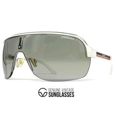 Details: -Color: White frame / Grey shield lens by Carrera -Size: Large / Frame width 141 mm / Frame height 53 mm / Temple length 115 mm -Made in Italy -Item-No. Carrera Topcar I Info/description: -Carrera's love for design and detail is evident from the spectacular collection of Carrera sunglasses that the brand has created for its fashion lovers worldwide. -The brand brings forth an opportunity to select from the most exceptional range of materials that range from aluminum to metal to plastic. Retro Wayfarer Shield Sunglasses For Summer, Vintage Aviator Sunglasses With Uv Protection For Outdoor, Retro Sunglasses With Mirrored Lenses For Streetwear, Retro Mirrored Sunglasses For Streetwear, Retro Polarized Sunglasses For Streetwear, Retro Shield Sunglasses For Summer Streetwear, Retro Silver Polarized Sunglasses, Vintage Aviator Sunglasses With Anti-reflective Coating For Outdoor, Vintage Aviator Sunglasses For Outdoor With Anti-reflective Coating