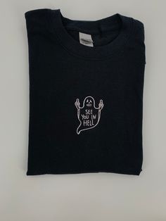 Halloween Tee! See You In Hell Ghost T-shirt embroidered on a 100% cotton tee in three color choices-sand beige, mocha brown or black. Made with love ❤️ Ships in 1-2 days with tracking ✉️ Custom Embroidered Cotton T-shirt For Streetwear, Custom Embroidered Cotton Tops For Streetwear, Embroidered Cotton Tops For Streetwear, Cotton T-shirt With Custom Embroidery For Streetwear, Embroidered Crew Neck T-shirt For Streetwear, Black Embroidered Tops For Halloween, Embroidered Cotton Shirt For Streetwear, Black T-shirt With Custom Embroidery For Streetwear, Black Crew Neck Top With Custom Embroidery