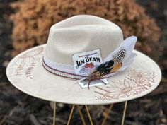 Custom hand burned wide brimmed Boho Western Hat made to order just for you.  Colors: Cream Sand (Light Tan) Cognac (Dark Tan) When my dad passed away, I made my mom a hat to commemorate him... with places they've traveled, songs they sung, and things that reminded her of him. I loved it so much, I made myself one with my moms favorite Bible verse, my dads ammo casing and so many things I cherish. When I posted them to my friends, I started getting others wanting a special custom hat.  One for a Custom Brimmed Felt Hat For Festivals, Cream Brimmed Hat For Western-themed Events, Handmade Western Cream Hat Band, Handmade Cream Western Hat Bands, Cream Country Hat For Festivals, Cream Wide Brim Hat For Western-themed Events, Cream Handmade Western Hat Bands, Country Style Cream Hat For Festivals, Cream Country Style Hat For Festivals