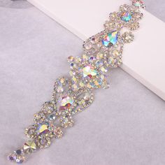 a bracelet with lots of crystals on it