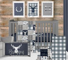 a baby crib bedding set with deer and buffalo prints on the wall next to it