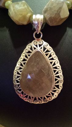 "One strand beaded faceted ( mossy jasper) I believe, not sure. It's beautiful, that is the important part. The pendant is sterling and a little less than 3\" long, including bail and 1 3/4\" wide. The stone is faceted and looks like a greenish quartz, it's pretty amazing. The necklace measures 20\" long. Looks great with any outfit. If you like it \" pin it \"." Pin It, Austin Tx, Austin, Beaded Necklace, Necklaces, Pendant Necklace, Stone, Pendant