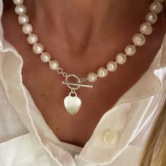 "A beautiful necklace of knitted genuine pearls with a solid sterling heart pendant hanging from  toggle clasp.  An instant classic and great addition to any jewelry collection.  A fantastic gift to give and to receive ❤️ available in 16.5\", 18.5\", 20.5\" lengths.  measurements including the toggle clasp.  heart pendant measures 16 x 20mm, solid 925 sterling silver  the pearls are cultured akoya freshwater pearls, 9-10mm, each will have its own unique variations - no two pearls are the same.  all components are Solid 925 Sterling Silver available without pendant." Star Choker, Necklace Star, Star Charm Necklace, Toggle Necklace, Wrap Necklaces, Silver Heart Pendant, Beaded Pendant Necklace, Choker Collar, Necklace Choker