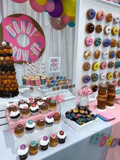 there are many cupcakes on the table at this birthday party that is ready to be eaten