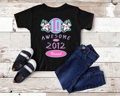 Amazing Since 2012 Funny Dancing Unicorn - Kids Big 10th Birthday Celebration Shirt - Born in 2012 - Aged 10 Years - boy or girl birthday gift! Love this design? Check out my other Kid/Baby Bday Birthday designs -> https://www.etsy.com/shop/craftsofhumanity?section_id=29621589 Know a cute little girl or boy turning 10 years old and born in 2012? Think they are Awesome? Get them this amazing 10 years old customized birthday shirt! Customize on the shirt: Age | Birth Year | Name (optional) This cu 10th Birthday Shirt, Dancing Unicorn, Celebration Shirt, Funny Dancing, Birthday Designs, Unicorn Kids, Cool Gifts For Kids, Birth Year, Gift Love