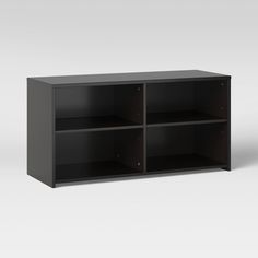 an empty black shelf with four shelves on each side and one door open to reveal the bottom