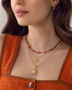 This dainty necklace, designed to sit at the chest, features double-sided red enamel bar links. The perfect chain to add a gorgeous pop of red to your necklace layers or wear alone for a delicate look.Soru Charms can also be added to this chainBehind the name: Named after the Etruscan goddess of spells Carmenta, known for chanting songs to ease the pain of women.Materials18ct gold plated silver and enamelChain length (approx)16" 10cm extender Red Beaded Chain Necklace Gift, Red Beaded Chain Necklace For Gift, Gift Red Beaded Chain Necklace, Dainty Red Charm Necklaces With Adjustable Chain, Red Pendant Necklace With Chain, Red Chain Choker Necklace, Red Pendant Chain Necklace With Clavicle Chain, Red Clavicle Chain Pendant Necklace, Red Double Strand Beaded Chain Jewelry