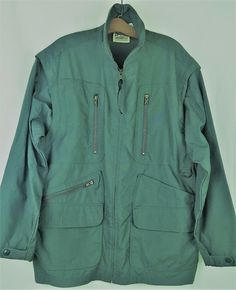 Travel Smith Womens Utility Jacket Hiking Safari Field Convertible Vest Sz L. Travel Smith Women's Utility Jacket - Great for hiking, bush, field, safari, birding - Juniper green (has some blue in it, depending on lighting) - Full zipper down front - Convertible with zip out sleeves, turns into vest - Multi-pockets:   2 Top pockets, vertical zip, 8"D x 4.5"W   4 Bottom pockets; 2 diagonal zip, 7"x10"D x 8"W                                 2 flap with hook & eye, 7"D x 8"W   1 Large back pocket, Functional Green Outerwear For Travel, Winter Utility Jacket With Long Sleeves For Adventure, Green Utility Outerwear For Outdoor, Adventure Utility Jacket With Pockets, Adventure Long Sleeve Utility Jacket With Pockets, Adventure Long Sleeve Outerwear With Pockets, Long Sleeve Adventure Outerwear With Pockets, Long Sleeve Outerwear With Pockets For Adventure, Long Sleeve Parka For Fall Adventure