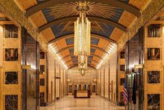 the inside of a building with marble floors and gold trimmings on the ceiling