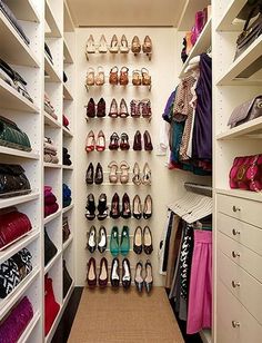 the closet is full of shoes and purses