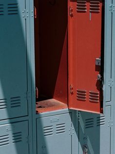 two red lockers are next to each other in the same color and size, with one door open