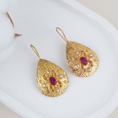 We produce our  jewelery in Istanbul. We use semi precious gemstones and brass covered with 18k-24k  gold. Their nature may cause gemstones to be in different shapes and color. Do not forget to explore more pieces using the link below. https://www.etsy.com/shop/FndJewelry  THANK YOU🤍 We are so grateful you have chosen FndJewelry. We love sharing happiness with you, it is only real when shared! Elegant Gold Teardrop Earrings With Gemstone, Gold Hammered Pearl Earrings Gift, Gold Brass Earrings With Gemstone, Gold Teardrop Pearl Earrings For Festive Occasion, Teardrop Gemstone Earrings In Gold Plated, Gold Gemstone Earrings As A Gift, Gold Oval Pearl Earrings For Gift, Gold Gemstone Earrings For Gift, Gold Oval Gemstone Earrings