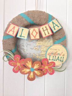 a wreath with the word aloha hanging from it