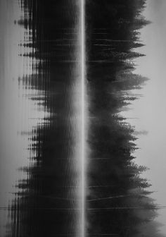 a black and white photo of water reflecting off the side of a building's wall