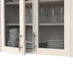 a white cabinet with glass doors and shelves filled with plates, bowls and glasses on it