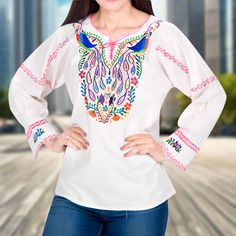 Blusa Bordada TM-77532 Embroidered Blouse White Long Sleeve Tops With Intricate Embroidery, White Embroidered Long Sleeve Top, White Embroidered Long Sleeve Blouse, White Long Sleeve Embroidered Top, Summer Long Sleeve Embroidered Top With Multicolor Embroidery, Long Sleeve Blouse With Multicolor Geometric Embroidery, Long Sleeve Embroidered Blouse, Festival Embroidered Top With Hem Detail, Long Sleeve Blouse With Geometric Embroidery