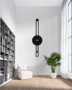 a large clock mounted to the side of a wall next to a chair and bookcase