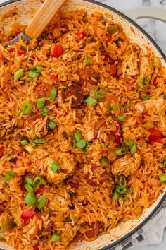 a skillet filled with rice and vegetables